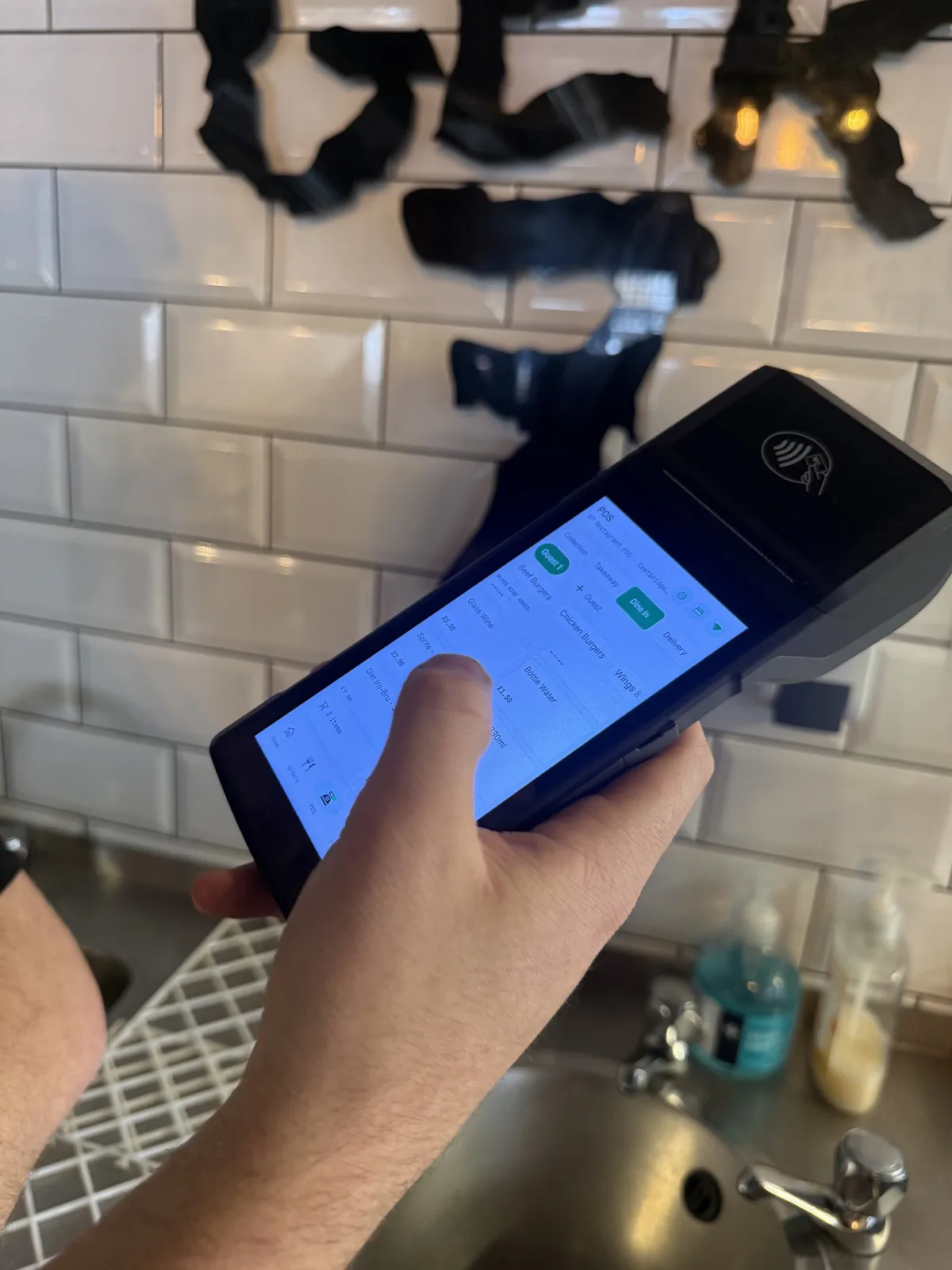 Handheld Prepd POS being used at Burger7